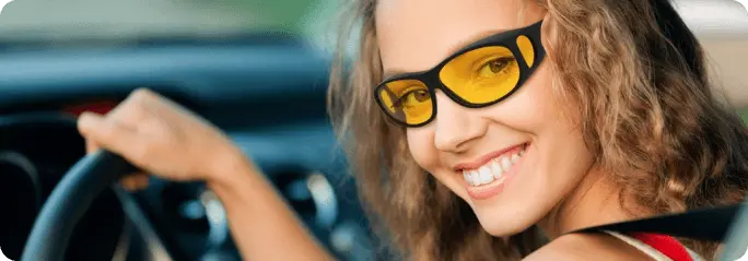 Image of a young woman driving wearing DaySight Glasses